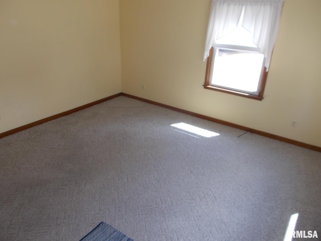 615 N 4th St, Clinton, IA 52732 - spare room with carpet flooring and baseboards