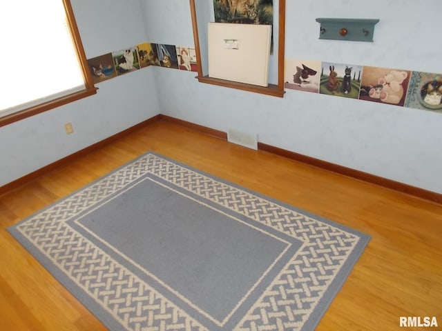 615 N 4th St, Clinton, IA 52732 - unfurnished room featuring wood finished floors and baseboards