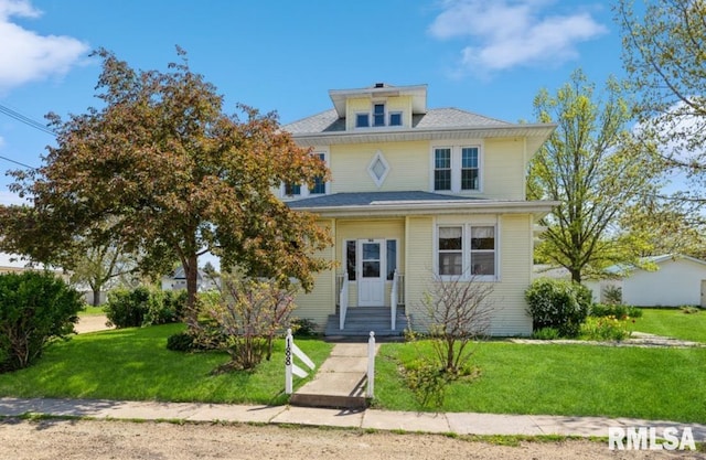 traditional style home with a front yard