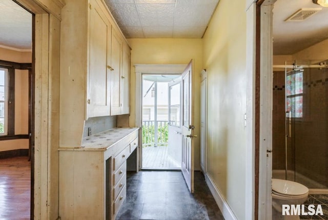 doorway to outside with baseboards