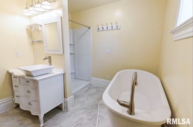 full bath with marble finish floors, vanity, a soaking tub, and a shower stall