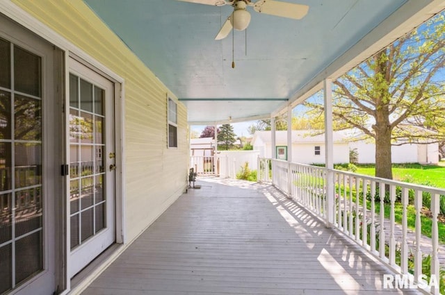 wooden deck with a ceiling fan