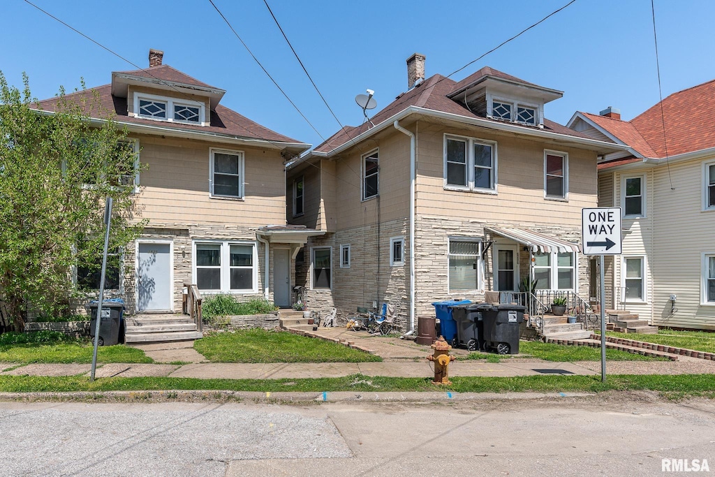 view of front of property featuring stone siding and entry steps
