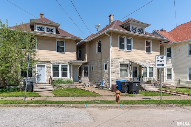 view of front of property featuring stone siding and entry steps
