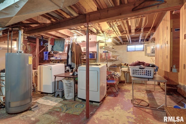 below grade area featuring gas water heater, independent washer and dryer, and electric panel