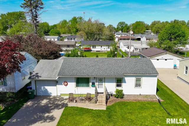 ranch-style home with driveway, a shingled roof, a garage, a residential view, and a front yard