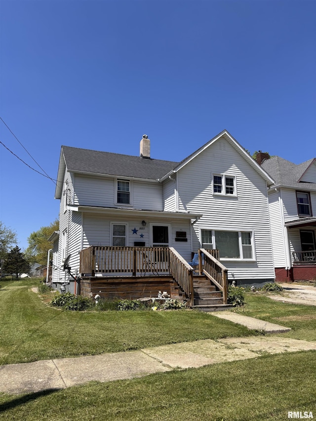 451 S Grove St, Kewanee, IL 61443 - view of front of house with a chimney, a front yard, and a wooden deck