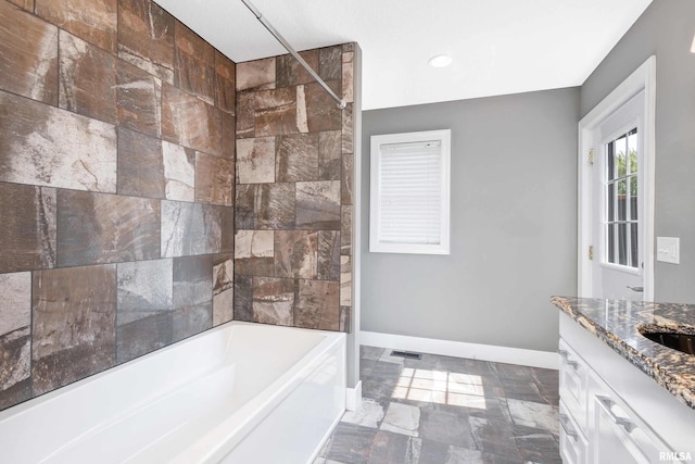 24711 178th St, Pleasant Valley, IA 52767 - bathroom with vanity, baseboards, recessed lighting, and washtub / shower combination