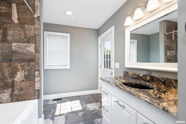 24711 178th St, Pleasant Valley, IA 52767 - full bathroom featuring baseboards, vanity, tub / shower combination, recessed lighting, and marble finish flooring