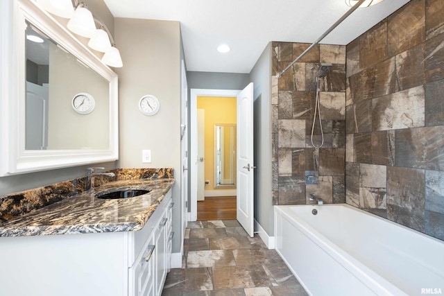 24711 178th St, Pleasant Valley, IA 52767 - bathroom featuring vanity, shower / washtub combination, stone finish floors, and baseboards