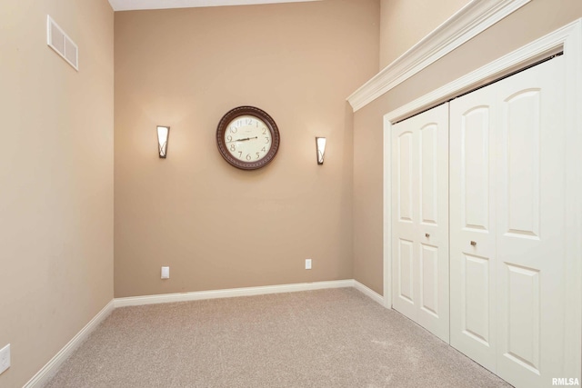 24711 178th St, Pleasant Valley, IA 52767 - unfurnished bedroom with carpet floors, baseboards, and a closet