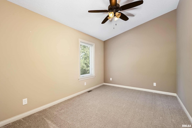 24711 178th St, Pleasant Valley, IA 52767 - spare room featuring light carpet, baseboards, and ceiling fan