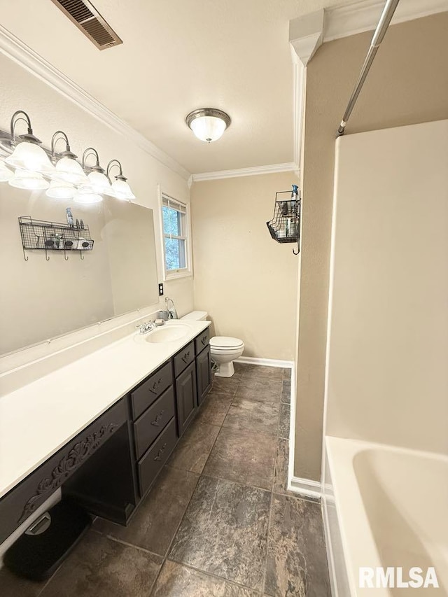 2939 Delora Ln, Herrin, IL 62948 - bathroom featuring ornamental molding, toilet, vanity, and baseboards