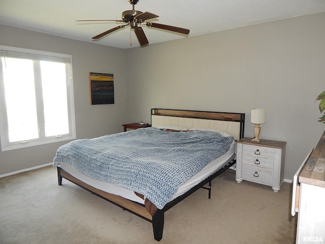 bedroom featuring baseboards, carpet floors, and ceiling fan