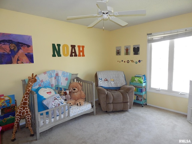 bedroom with carpet flooring, baseboards, and a ceiling fan