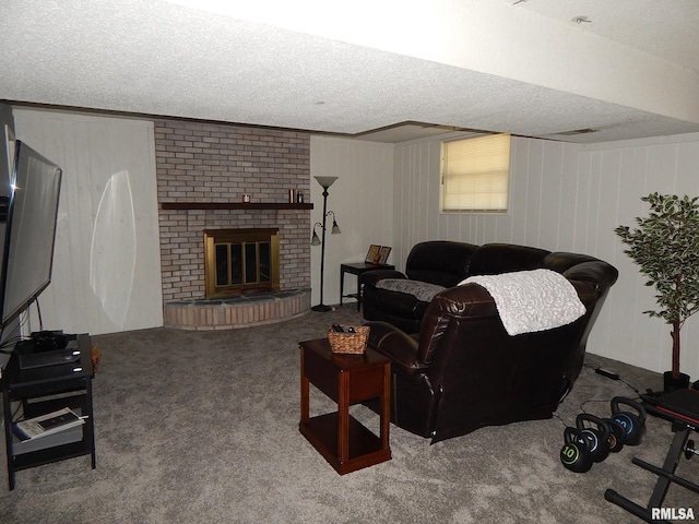 living area with carpet flooring, a textured ceiling, and a fireplace