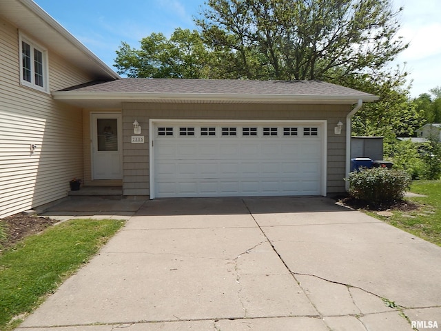 garage featuring driveway