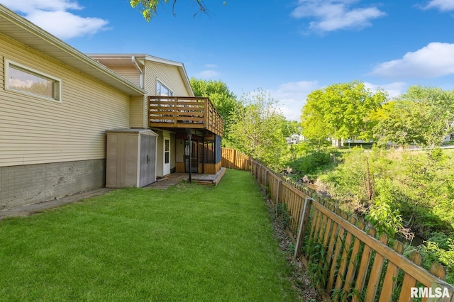 2885 Willow Dr, Bettendorf, IA 52722 - view of yard featuring a storage unit, an outdoor structure, and a wooden deck