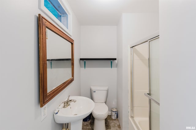 bathroom with toilet and a sink