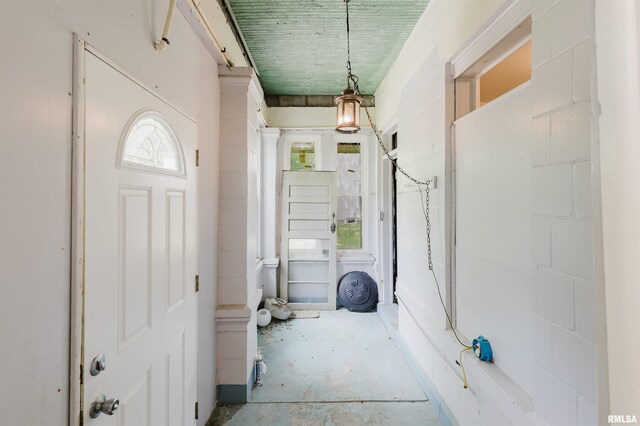entryway with healthy amount of natural light and concrete flooring