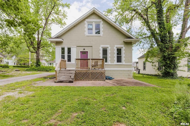 bungalow-style house featuring a front yard
