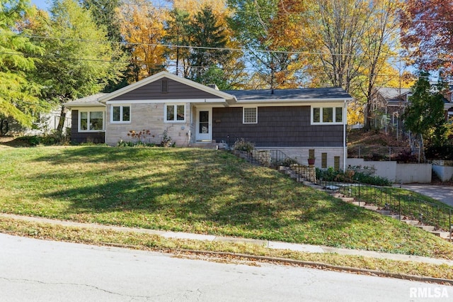 1 Kenwood Ave, Davenport, IA 52803 - ranch-style house with a front yard and stone siding