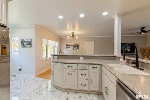 1 Kenwood Ave, Davenport, IA 52803 - kitchen featuring appliances with stainless steel finishes, a sink, recessed lighting, crown molding, and light marble finish flooring
