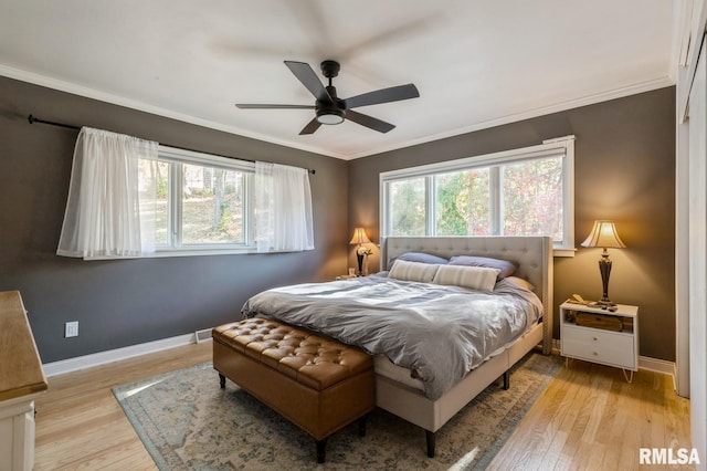 1 Kenwood Ave, Davenport, IA 52803 - bedroom with light wood-type flooring, ornamental molding, baseboards, and ceiling fan