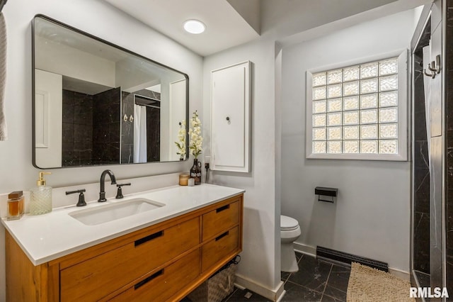 1 Kenwood Ave, Davenport, IA 52803 - bathroom with marble finish floors, baseboards, a tile shower, toilet, and vanity