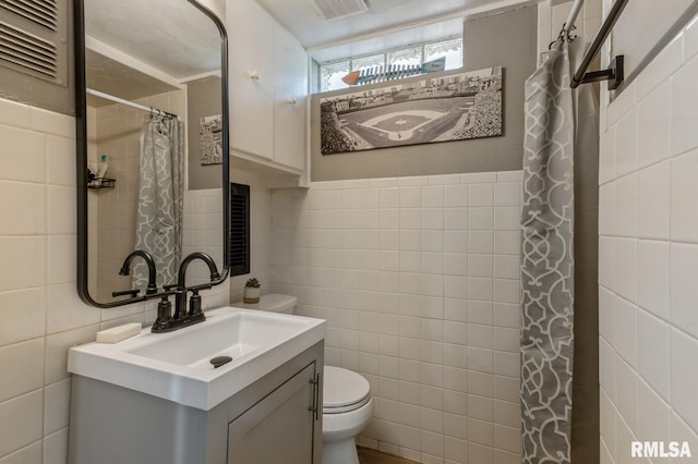 1 Kenwood Ave, Davenport, IA 52803 - full bathroom featuring tile walls, toilet, curtained shower, and vanity