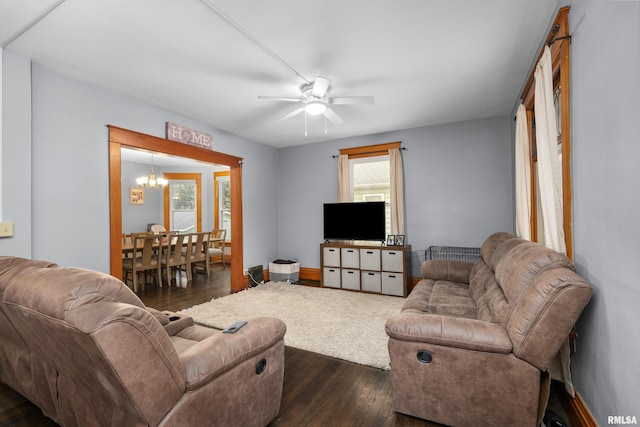 2307 N Ripley St, Davenport, IA 52803 - living room featuring dark wood finished floors, a chandelier, and ceiling fan