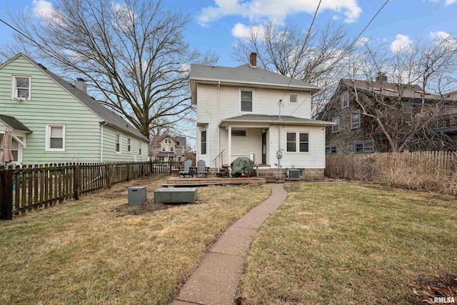 2307 N Ripley St, Davenport, IA 52803 - back of house with cooling unit and a chimney