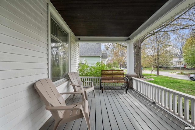2307 N Ripley St, Davenport, IA 52803 - wooden deck featuring covered porch