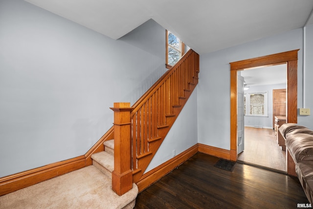 2307 N Ripley St, Davenport, IA 52803 - staircase with wood finished floors, baseboards, and ceiling fan
