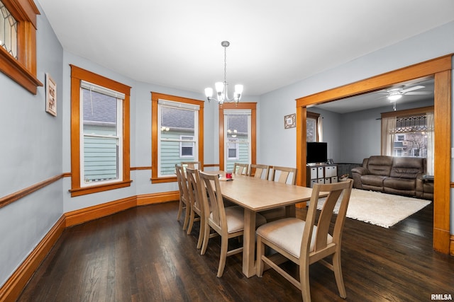 2307 N Ripley St, Davenport, IA 52803 - dining space with dark wood-style flooring, a chandelier, baseboards, and a ceiling fan