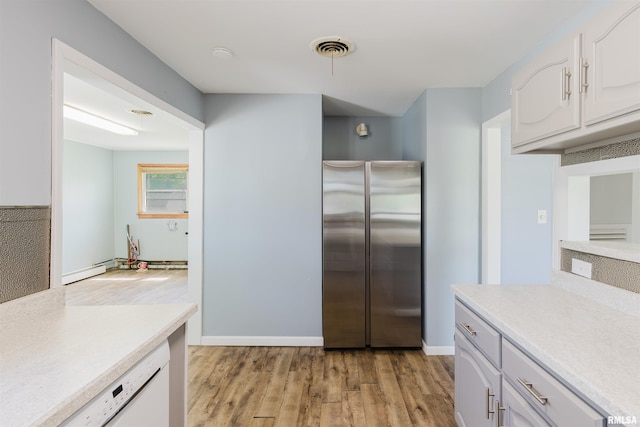 602 Barr St, Carterville, IL 62918 - kitchen with freestanding refrigerator, light wood finished floors, and light countertops