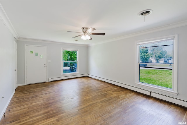 602 Barr St, Carterville, IL 62918 - empty room with a baseboard radiator, healthy amount of natural light, wood finished floors, ornamental molding, and a ceiling fan