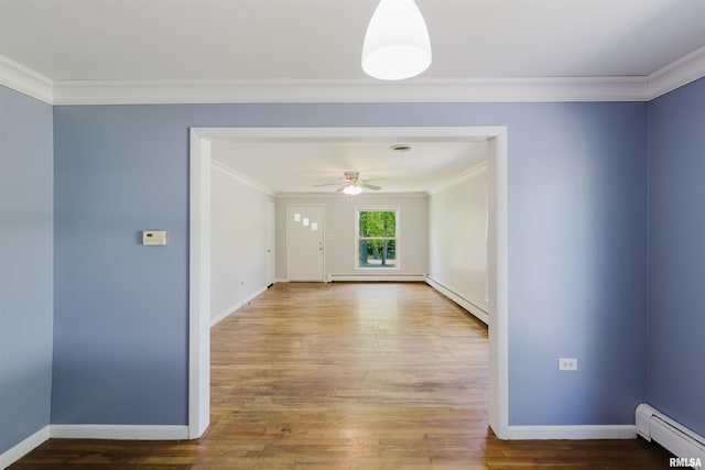 602 Barr St, Carterville, IL 62918 - unfurnished room with baseboard heating, ornamental molding, ceiling fan, a baseboard radiator, and wood finished floors