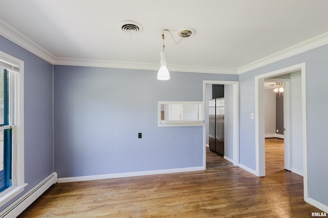 602 Barr St, Carterville, IL 62918 - spare room featuring a baseboard radiator, crown molding, wood finished floors, and baseboards