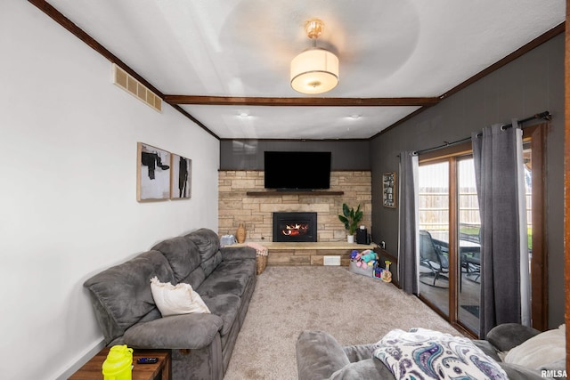 carpeted living room with beam ceiling and a fireplace