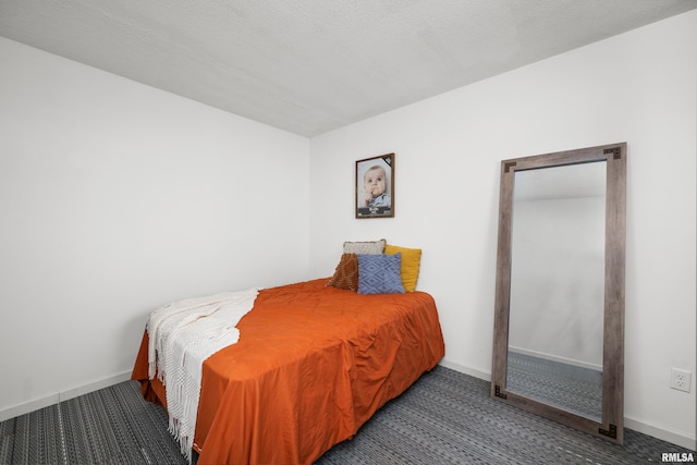bedroom with carpet and baseboards