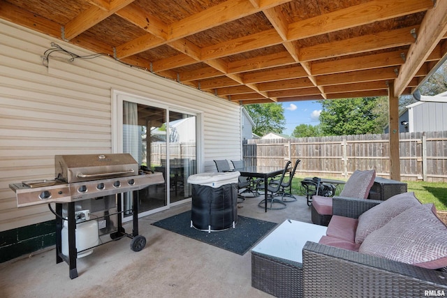 view of patio with fence, an outdoor hangout area, area for grilling, and outdoor dining space
