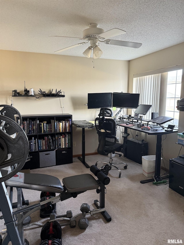 3205 S 16th Ave Unit 203, Eldridge, IA 52748 - home office with ceiling fan, carpet flooring, and a textured ceiling