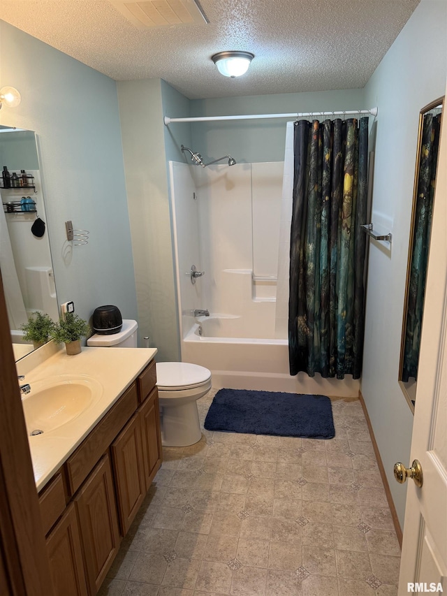 3205 S 16th Ave Unit 203, Eldridge, IA 52748 - bathroom with a textured ceiling, shower / bathtub combination with curtain, vanity, and toilet