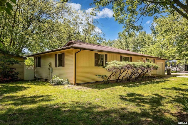 1401 Thomas St, Carterville, IL 62918 - rear view of house featuring a garage and a lawn
