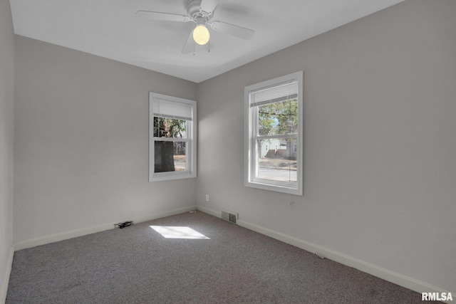 2910 Central Ave, Bettendorf, IA 52722 - carpeted spare room with baseboards and ceiling fan