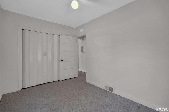 2910 Central Ave, Bettendorf, IA 52722 - unfurnished bedroom with carpet, baseboards, a closet, and a ceiling fan