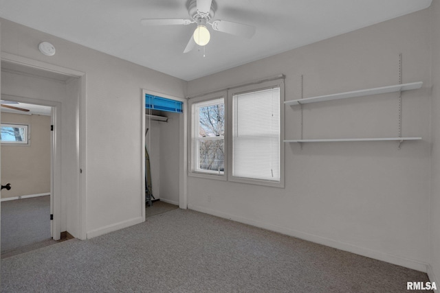 2910 Central Ave, Bettendorf, IA 52722 - unfurnished bedroom featuring carpet floors, baseboards, a closet, and ceiling fan