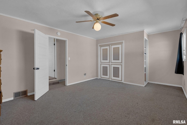 2910 Central Ave, Bettendorf, IA 52722 - carpeted empty room with ceiling fan, crown molding, and baseboards