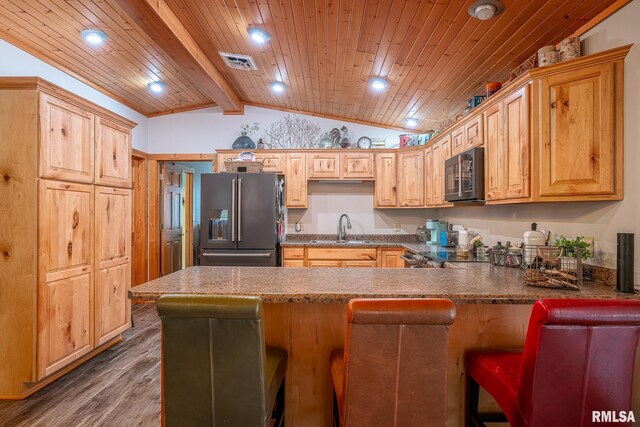 1012 Viaduct Rd, Savanna, IL 61074 - kitchen featuring high quality fridge, a sink, a peninsula, wood finished floors, and a breakfast bar area